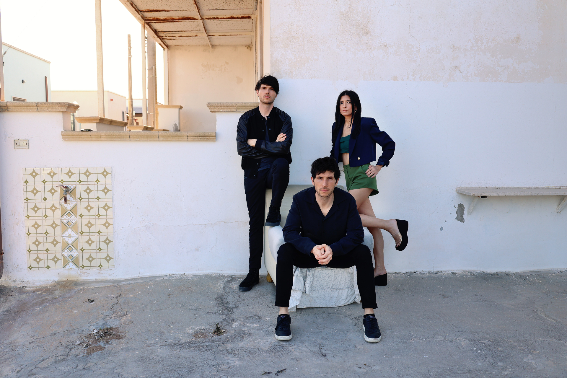 MICCOLI — full-colour editorial portrait of the trio in an Italian courtyard